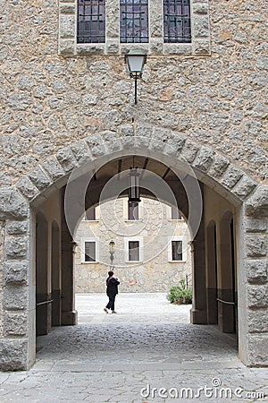 Female visitor in the monastery El Santuari de Lluc, Mallorca, Spain Editorial Stock Photo