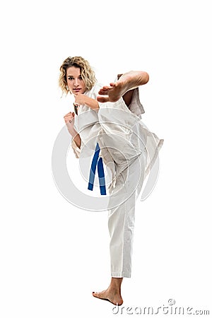 Female wearing martial arts uniform making karate move Stock Photo