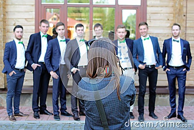 Female wedding photographer in action Stock Photo