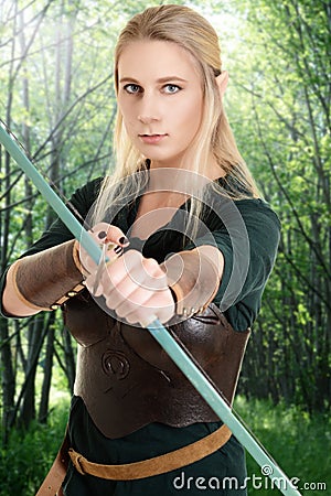 Female wood elf using bow and arrow Stock Photo