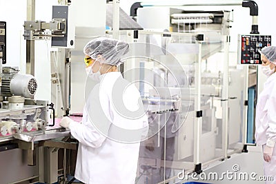 Female Workers At Pharmaceutical Factory Stock Photo