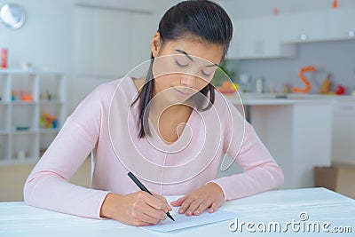 Female writing a letter Stock Photo