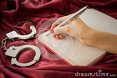 Female writing in notebook Stock Photo