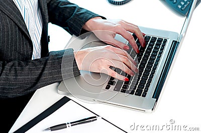 Females hands typing on laptop Stock Photo