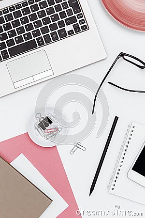 Feminine business desk from above on white background Stock Photo