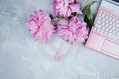 Feminine business mockup with pink laptop and peonies bouquet Stock Photo