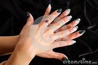 Feminine decorated nails with green colors Stock Photo