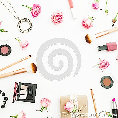 Feminine desk with gift box, pink roses, cosmetics, diary on white background. Top view. Flat lay. Valentines day frame compositio Stock Photo
