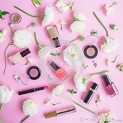 Feminine desk with woman cosmetics and white flowers on pink background. Flat lay, top view. Beauty concept for blog Stock Photo