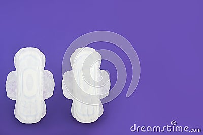 Feminine hygienic white pads for menstruation on a purple background very peri Stock Photo