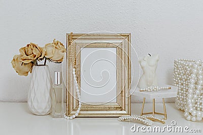 Feminine Mockup vintage gold frame and candle. Wedding still life. Stock Photo