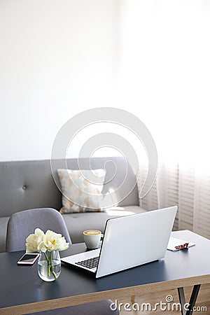 Feminine office space with a lot of ntural light Stock Photo