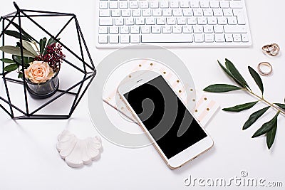 feminine tabletop flatlay with smartphone mock-up Stock Photo