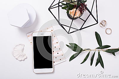 feminine tabletop flatlay with smartphone mock-up Stock Photo