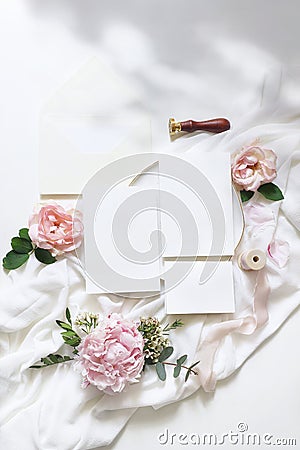 Feminine vertical wedding, birthday mock-up scene. Blank paper greeting cards, envelope, ucalyptus, pink roses, peony Stock Photo