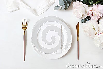 Feminine wedding, birthday desktop mock-up scene. Porcelain plate, blank craft paper greeting cards, silk ribbon, golden Stock Photo