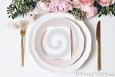 Feminine wedding, birthday desktop mock-up scene. Porcelain plates, blank paper greeting, menu card, ribbon, golden Stock Photo