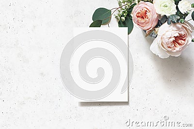 Feminine wedding, birthday mock-up scene. Blank paper greeting card. Bouquet of blush pink English roses, ranunculus Stock Photo