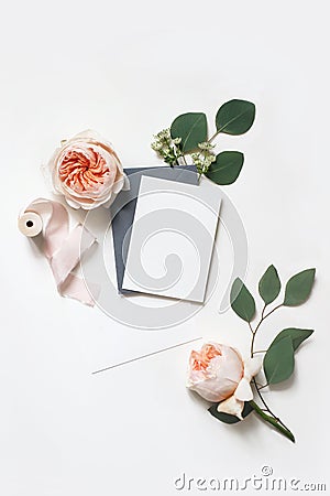 Feminine wedding, birthday mock-up scene. Blank paper greeting cards, envelope, silk ribbon, eucalyptus leaves and blush Stock Photo