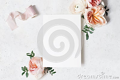 Feminine wedding, birthday stationery mock-up scene. Blank paper greeting card with bouquet of green leaves, blush pink Stock Photo