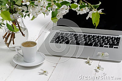 Feminine workplace concept. Freelance fashion comfortable femininity workspace with laptop, coffee, flowers on white background Stock Photo