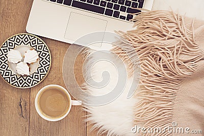 Feminine workplace concept. Freelance workspace with laptop,sweets. Blogger working. Stock Photo