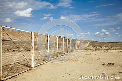 Fence in Azerbaijan desert surrounding Gobustan National Park Stock Photo