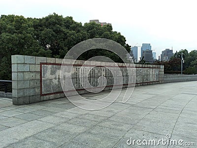 Fence of The Bund Historical Museum Tower in Shanghai, China with trees behind Editorial Stock Photo