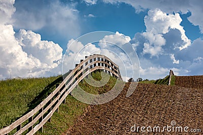 Fence line through the field Stock Photo