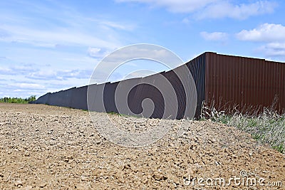 Fence made of brown metal professional flooring Stock Photo