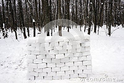 A fence made of snow bricks, built for playing in the forest Stock Photo