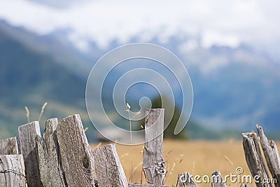 A fence and mountain view - Mestia, Georgia Stock Photo