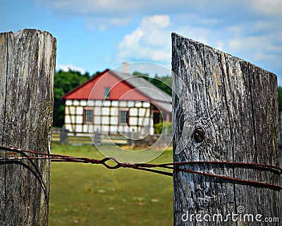 Fence Posts with Historic Building at Old World Wisconsin Stock Photo