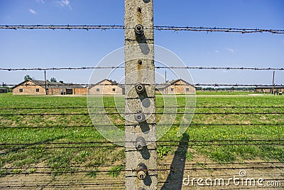 Fence surrounding barracks in Auschwitz-Birkenau concentration camp, Poland Editorial Stock Photo