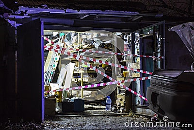 Fenced garage at the crime scene, background blurred with bokeh effect Stock Photo