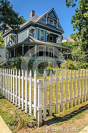 Fenced House in Oak Park Stock Photo