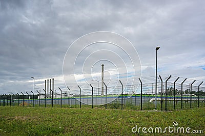 Fenced Landfall station of nord stream 2 in Lubmin near Greifswald under a cloudy sky, gas pipeline through the Baltic Sea from Stock Photo