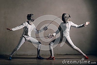 Fencer with fencing sword. Fencers duel concept. Stock Photo