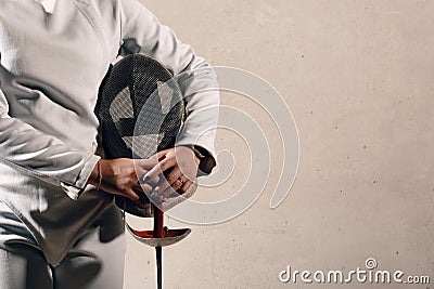 Fencer woman with fencing sword ammunition closeup. Stock Photo