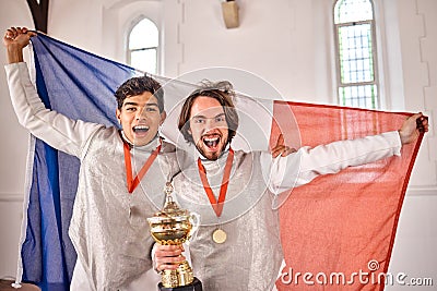 Fencing, France flag and portrait of men with trophy for winning competition, challenge and match. Sword fighting Stock Photo