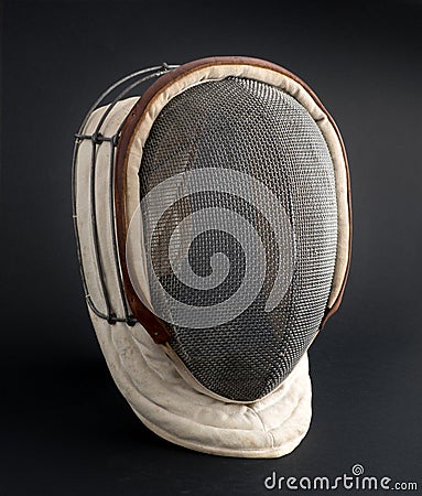 Fencing mask on a black background Stock Photo