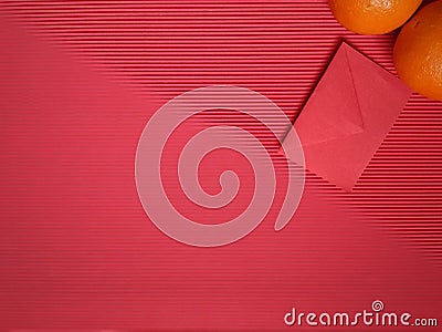 inspirational chinese new year concept image of red envelope and oranges in red colour background Stock Photo