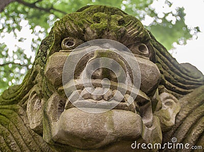 Closeup of aggressive face on statue at religious Ghost City, Fengdu, China Stock Photo