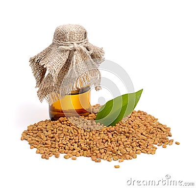 Fenugreek seed with pharmaceutical bottle. (Trigonella foenum-graecum) Stock Photo