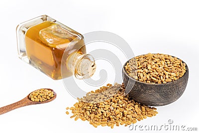 Fenugreek seeds and oil - Trigonella foenum - graecum. Text space Stock Photo