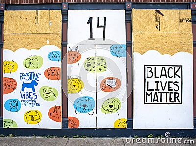Ferguson, Missouri, USA, June 20, 2020 - black lives matters sign painted on Ferguson Missouri business boarded up windows after p Editorial Stock Photo