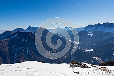Ferlacher Horn - Scenic view on snow capped mountain peaks of Karawanks, Julian and Kamnik Savinja Alps Stock Photo