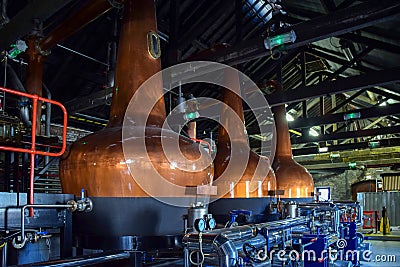 Fermentation tanks for making different types of whiskey in the Distillery Stock Photo