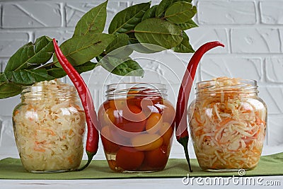 Fermented foods. Sauerkraut, salted tomatoes on a white background. Vegetarian food Stock Photo