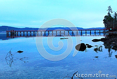 Fernwood dock at dusk, Salt Spring Island, BC Stock Photo